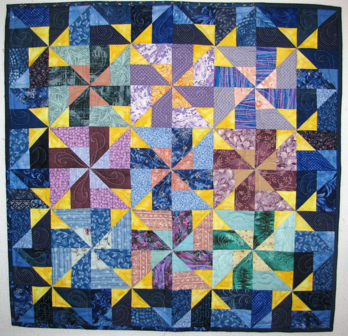 By Louisa Robertson. http://louquilts.blogspot.ca/2015/05/spring-cleaning-challenge.html Here is my Peekaboo Pinwheels quilt, my version of the Scrappier quilt layout. I had great fun playing with fabrics in Electric Quilt and discovered there were lots of pinwheels hiding in the design.